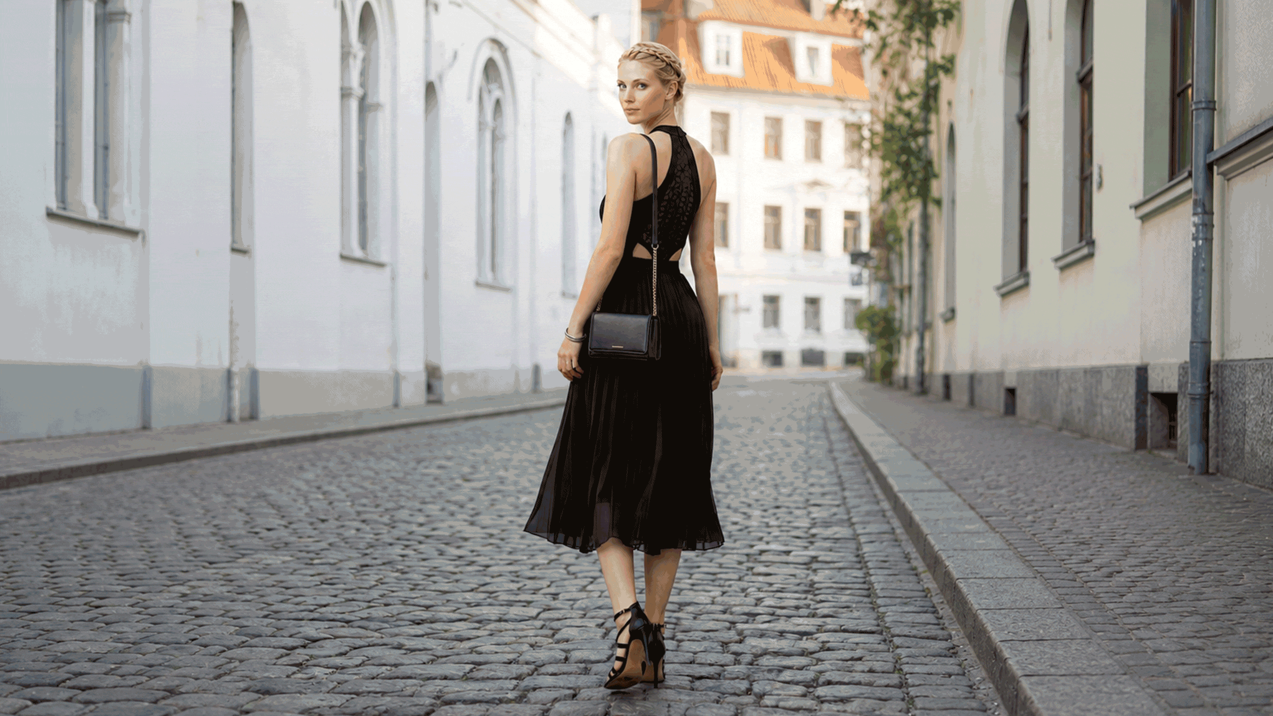 Woman wearing Lulli streetwear on a cobblestone street